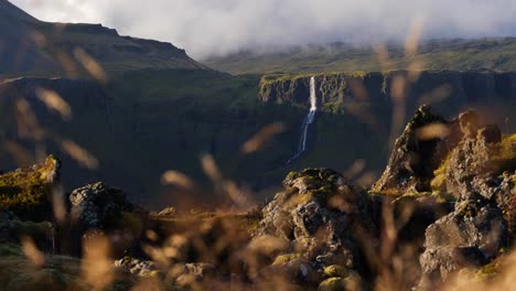 A-waterfall-in-Iceland,-falling-from-the-top-of-a-tall-mountain