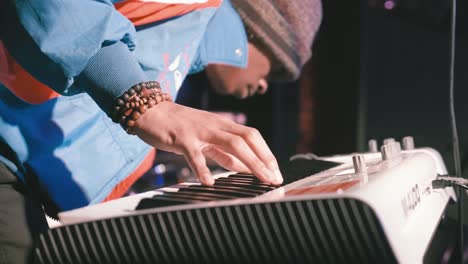 Atlanta,-GA---December-15,-2018:-Close-up-shot-of-a-keyboard-players-hands-during-a-lively-and-energetic-hip-hop-concert-in-an-underground-urban-nightclub-popular-with-millennials