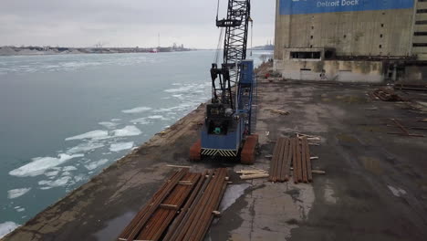 An-old-heavy-equipment-crane-sits-abandoned-in-front-of-Boblo-Island-in-Detroit