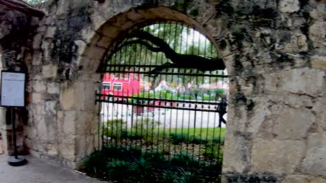 Stone-Walls-line-The-Alamo-grounds-where-visitors-can-learn-of-the-deeds-of-Davy-Crockett-and-William-Travis-during-the-13-days-of-the-siege-and-battle-for-Independence-4K30fps