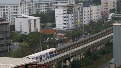 A-single-BTS-Skytrain-cart-rides-over-the-tracks-in-Bangkok,-Thailand