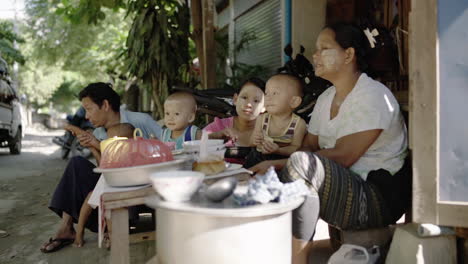 burmese-family-having-lunch-on-the-side-of-a-street