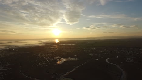 Aerial-shot-of-the-sun-setting-over-the-north-of-England-coast-line