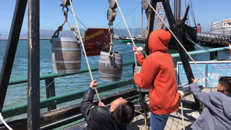 Slow-motion---Three-brothers-happily-playing-at-Pier-39-in-San-Francisco,-California