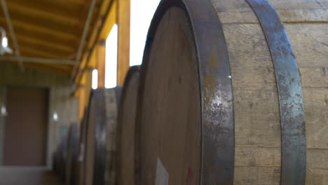 Close-up-of-a-row-of-Bourbon-Barrels-at-the-High-West-Distillery-near-Wanship,-Utah