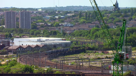 Time-Lapse-of-Various-Trains-Approaching-Leeds-City-Centre-Station-on-an-S-Bend-of-Track-during-a-Bright-Summer’s-Day-with-Crane-in-Foreground
