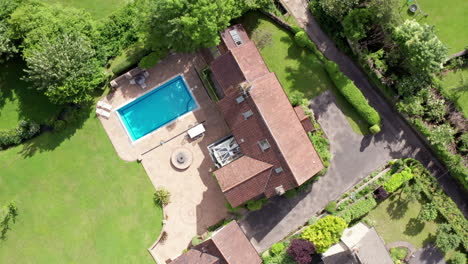 Rotating-Aerial-Shot-of-a-Large-Rural-Family-Home