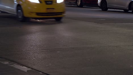 Close-up-to-busy-street,-summer-night-time,-traffic-in-New-York-City