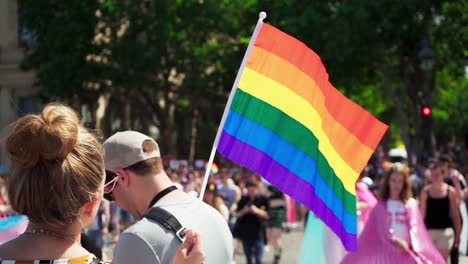 The-rainbow-flag-waving-in-the-wind-at-the-Pride-Parade-in-Paris,-France-2019