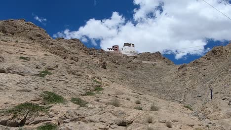 A-time-lapse-of-clouds-above-monastery-moving-fast-with-a-blue-sky-near-the-Leh-palace