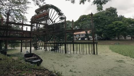 Water-Wheel-in-Algae-Filled-River