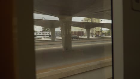 Inside-view-of-a-train-leaving-Campanhã-train-station-in-Porto,-Portugal