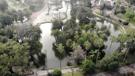 aerial-shot-of-park-lake-with-palm-trees