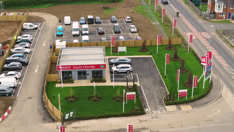 Static-aerial-view-of-traffic-passing-by-the-Redrow-Homes-show-home-at-the-Canterbury-development-names-the-Hoplands