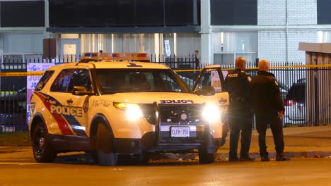 Toronto,-Canada---Nov-10th-2020-:-Two-policemen-speak-during-an-accident-examination-In-Barricade