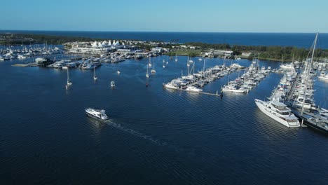 A-high-panning-view-of-a-city-marina-located-inside-a-protected-urban-boat-harbor-on-the-Gold-Coast