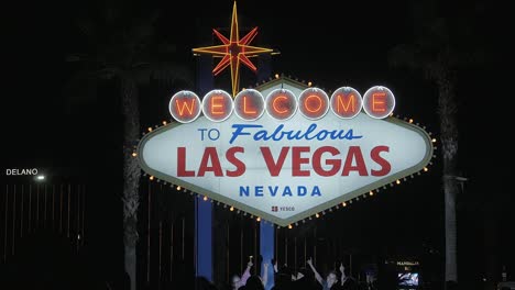 Welcome-to-Fabulous-Las-Vegas-sign-during-the-night-with-the-delano-hotel-name-in-the-background