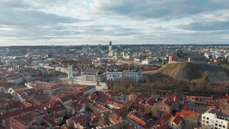 AERIAL:-Vilnius-Old-Town-During-Golden-Hour-with-Gediminas-Tower-And-Cathedral