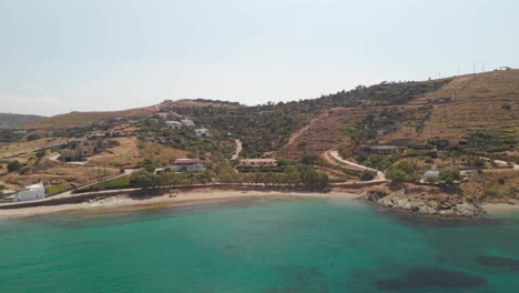 Aerial-orbit-around-beautiful-turqoise-beach-and-hills-on-Greek-Island