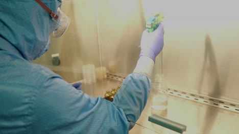 Scientist-Wearing-Full-PPE-Working-In-Clean-Room