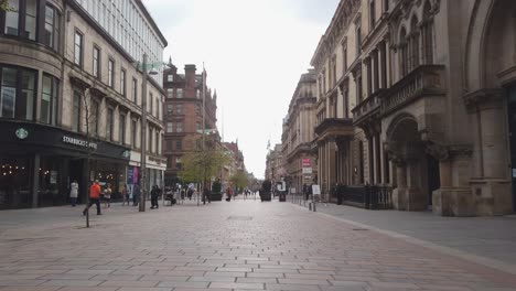 People-walking-in-a-quiet-city-centre-during-the-coronavirus-lockdown