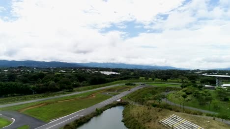 aerial-autodrome-with-lake-on-a-sunny-day