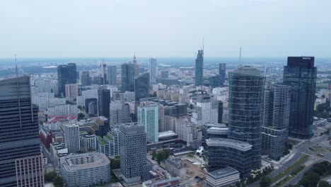 A-drone-video-skyscrapers-of-in-Warsaw,-Poland's-city-center