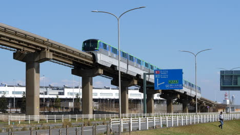 Exterior-of-monorail-tram-train,-Tokyo-Haneda-Airport,-tripod,-spring