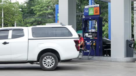 The-car-was-filling-up-at-the-gas-station-PTT-in-Bangkok,-Thailand