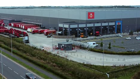 Aerial-view-royal-mail-parcel-service-hub-Warrington-England-rising-shot