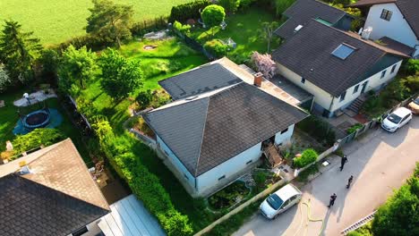 AERIAL---Scene-of-a-couch-fire-in-a-house-in-Oberwaltersdorf,-Austria,-wide-shot