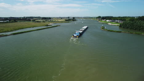 Wide-aerial-view-of-inland-vessel-Alina-Lemmer-on-Dutch-river-de-Lek