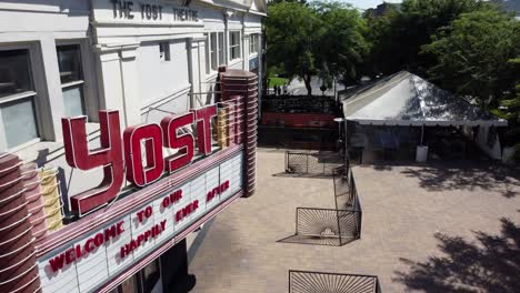 Cinematic-crane-shot-rising-above-the-front-entrance-and-marquee-sign-of-the-famous-Yost-Theater