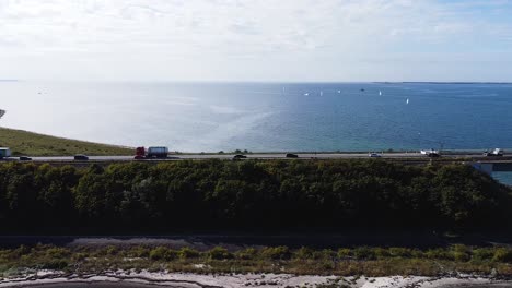 Aerial-View-Over-Busy-Bridge-Next-To-North-Sea-On-Sunny-Day,-Germany