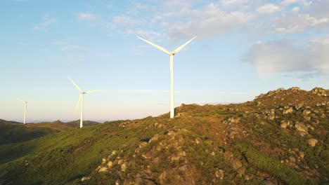 Wind-turbines-farm-ontop-of-mountain-of-Caramulo-at-sunrise,-Portugal