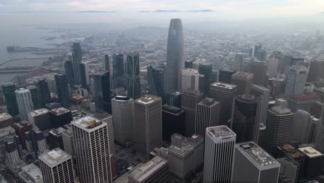 Aerial-view-overlooking-high-rise-in-downtown-San-Francisco,-California,-USA---tilt,-drone-shot