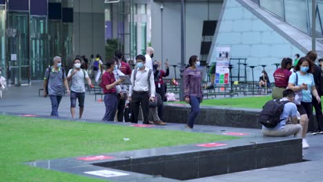 People-selling-services-at-Raffles-Place-on-a-weekday-afternoon