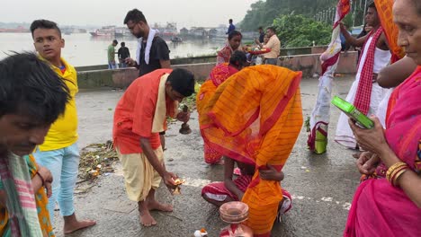 People-are-worsiping-kola-bou-wrapped-in-orange-saree