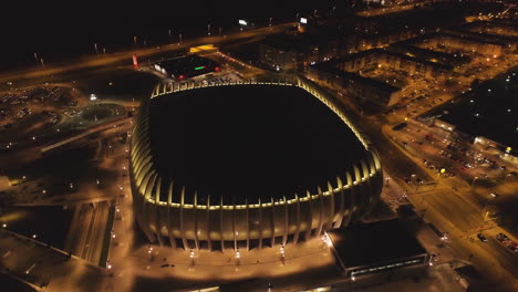 Arena-Zagreb-Night-Time-Aerial-Shot-High-Above-Stadium-Exterior
