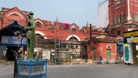 Slow-motion-shot-of-the-entrance-of-the-new-hogg-market-which-is-very-busy-during-Christmas-time-on-a-sunny-day-in-Kolkata