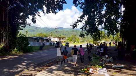 People-at-a-local,-small-fruit-and-vegetable-market-stall-in-the-town-of-Arawa-on-the-tropical-island-of-Autonomous-Region-of-Bougainville,-Papua-New-Guinea