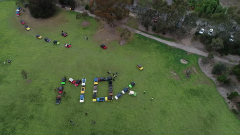 Moke-Owners-Association-50th-Anniversary-Convoy---Slow-pan-across-word-sign-in-the-making