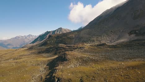 Drone-shot-flying-over-barren-moonline-landscape-in-Switzerland-in-4k