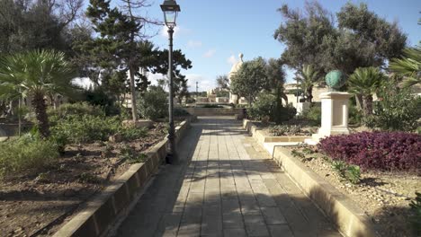 Walking-in-Gardjola-Gardens-with-Olive-Grooves-and-Stone-Path-in-Senglea