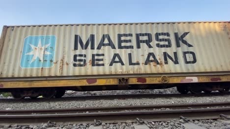 Cargo-Containers-Transportation-On-Freight-Train-Going-Past