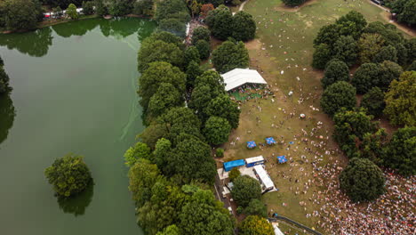 Atlanta-Georgia-Aerial-v732-drone-hyperlapse-birds-eye-view-across-midtown-piedmont-park-with-outdoor-music-festival---September-2021