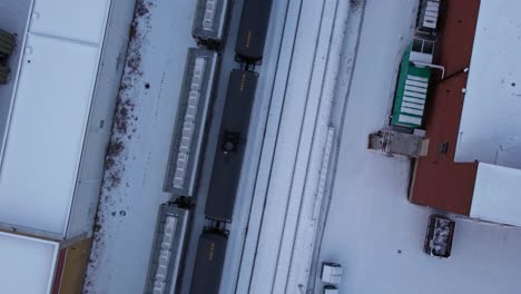 Train-oil-trailers-City-downtown-Calgary-winter-snow-tilt