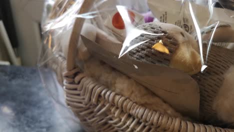 Mother-and-baby-shower-wicker-gift-basket-with-fluffy-plush-toys-and-parenting-accessories