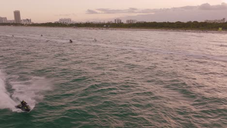 Jet-skis-competition-running-on-sea-along-Miami-Beach-coast,-Florida