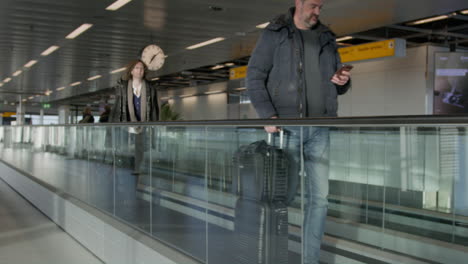 Amsterdam-Airport-Timelapse-People-Walking-Through-The-Airport-4K-Slow-Motion-RED-Camera